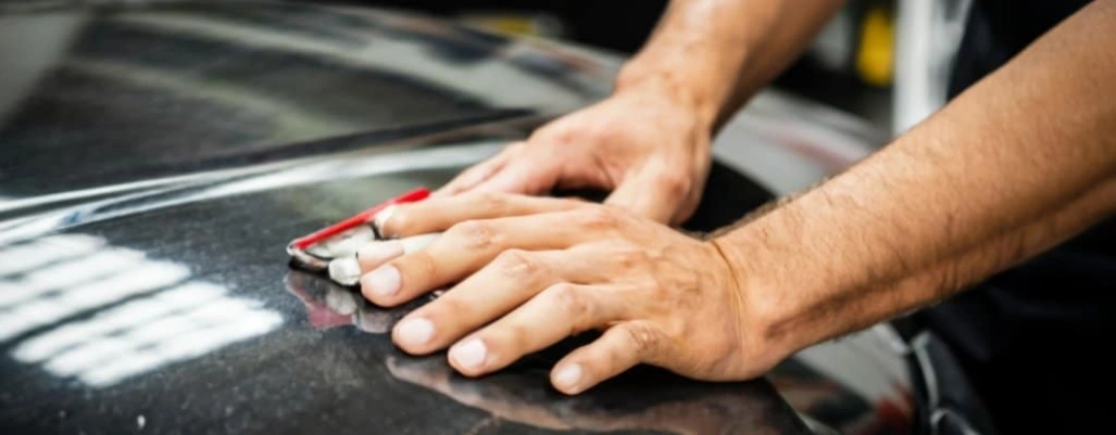 Worker repairing car